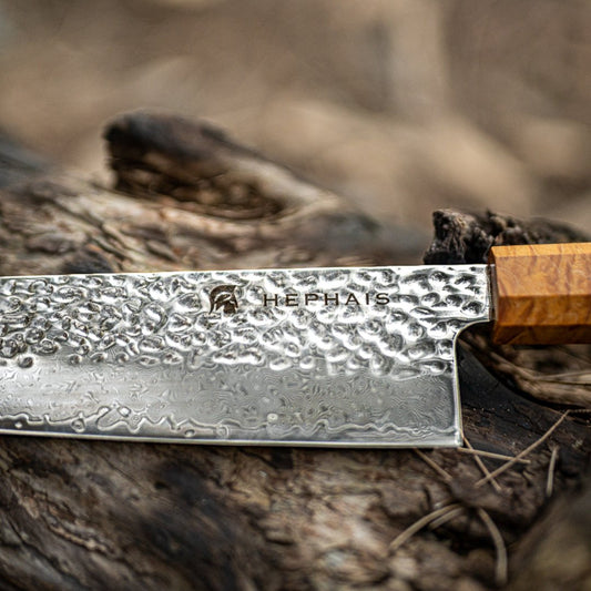 a close up of a hephais damascus knife 