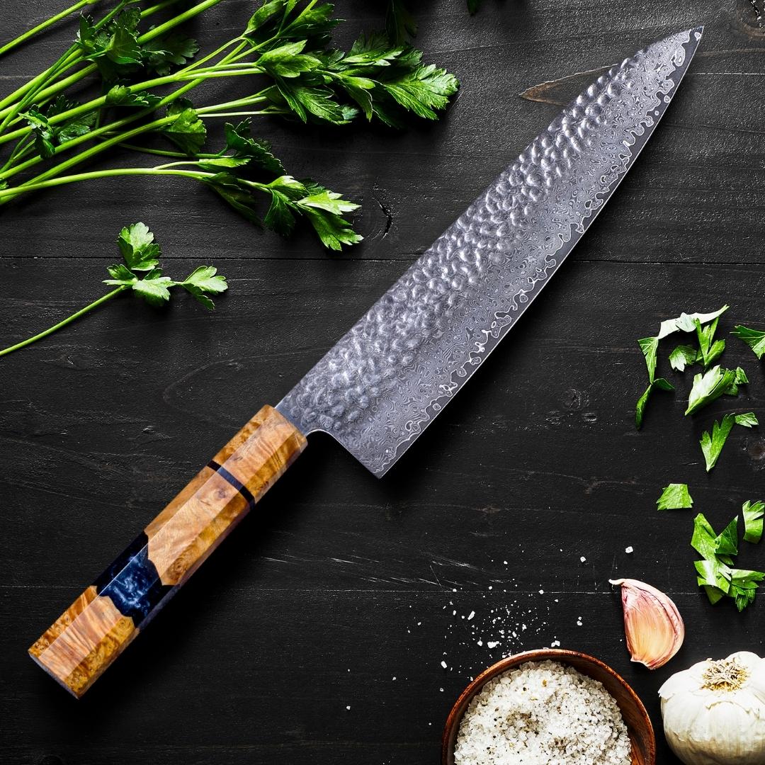 Damascus steel knife laid on a black wooden block