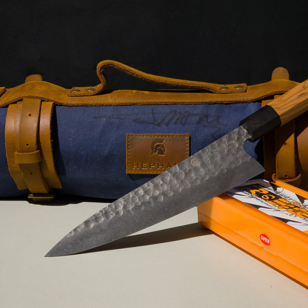 Chef knife, knife roll and sharpening stone