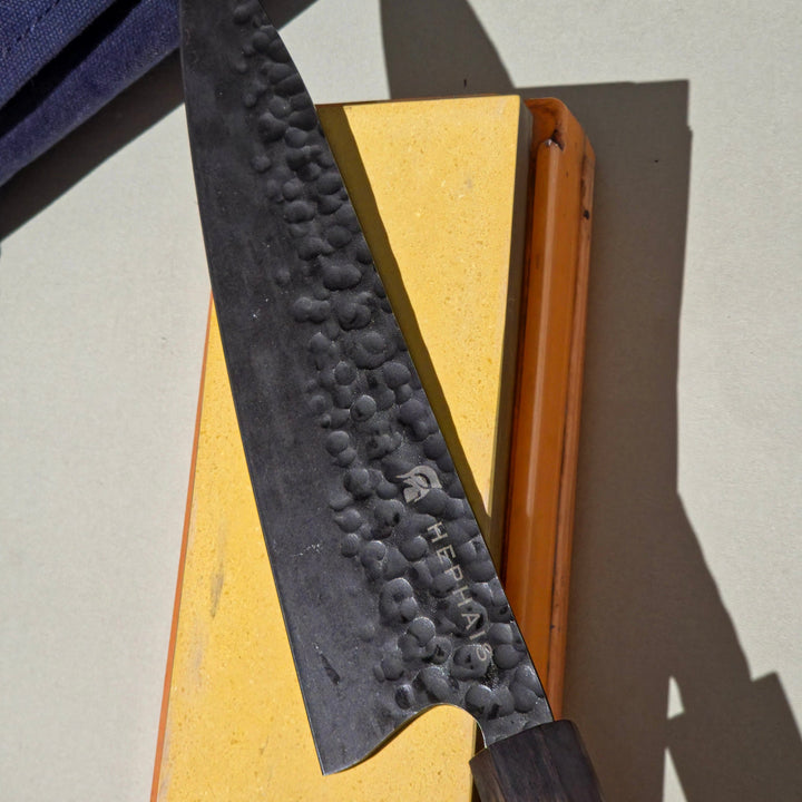 Chef knife on the sharpening stone