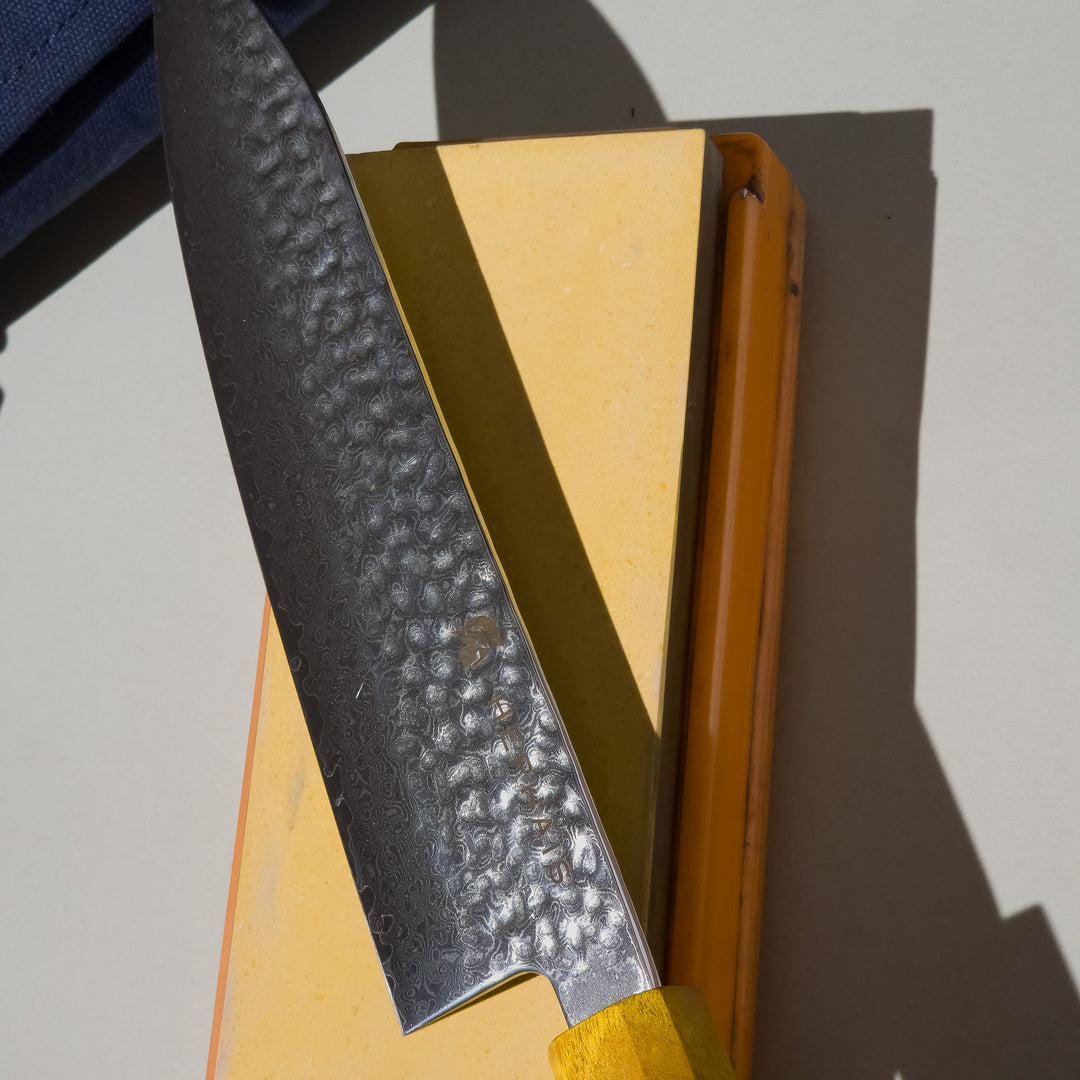 chef knife on the sharpening stone