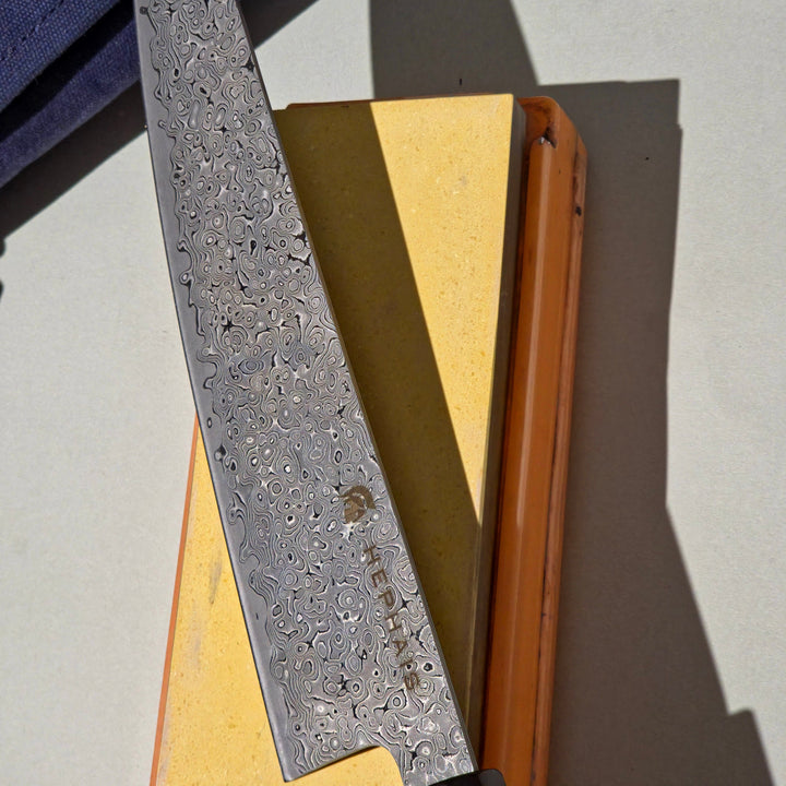 Chef knife on the sharpening stone