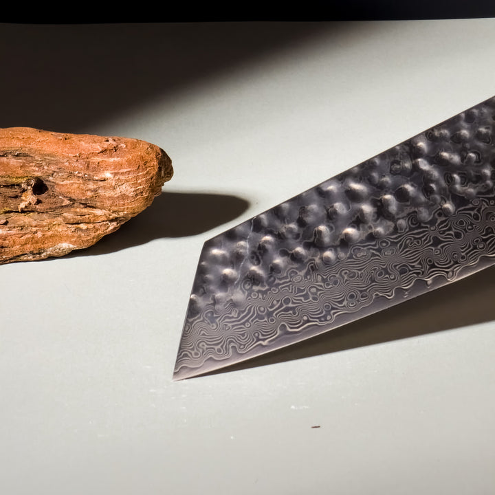 Close-up of Aurora Kiritsuke Knife Handle and Damascus Blade Design