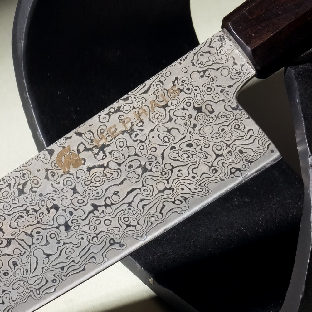 Close-up of Knox Chef Knife Handle and Matte Damascus Blade Design